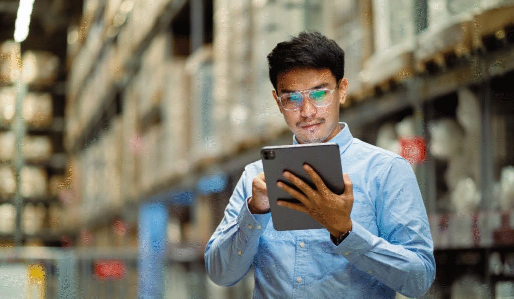 Worker reviewing their data analytics in shipping and logistics